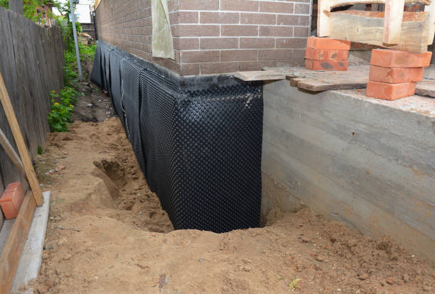 Happy homeowners after waterproofing job in Crown Point